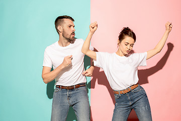 Image showing A couple of young man and woman dancing hip-hop at studio.