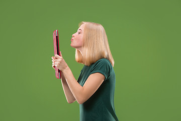 Image showing Businesswoman hugging laptop. Love to computer concept. Attractive female half-length front portrait