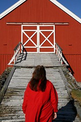 Image showing Woman in front of a barn bridge