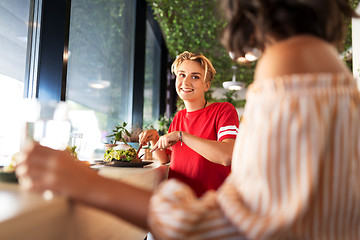 Image showing female friends eating at restaurant