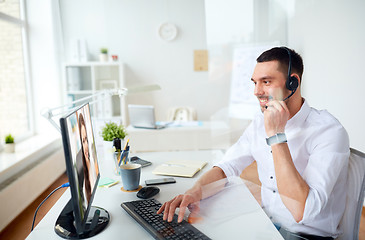 Image showing businessman having video call on pc at office