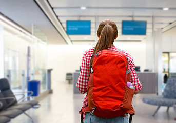 Image showing young woman with backpack over airport terminal