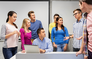 Image showing students and teacher with laptop at school