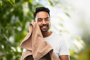 Image showing indian man with towel over natural background