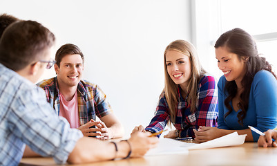 Image showing group of smiling students meeting at school