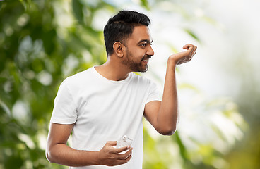 Image showing happy indian man with perfume