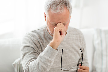 Image showing senior man with having headache