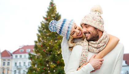 Image showing happy couple hugging over christmas tree