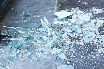 Image showing shards of broken glass on floor