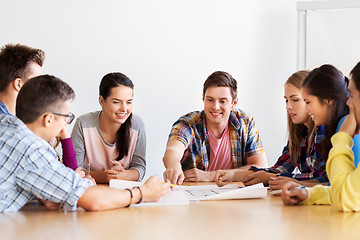 Image showing group of smiling students meeting at school