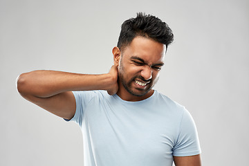 Image showing unhealthy indian man suffering from neck pain