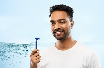 Image showing indian man shaving beard with razor blade