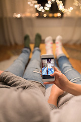 Image showing close up of couple taking foot photo by smartphone