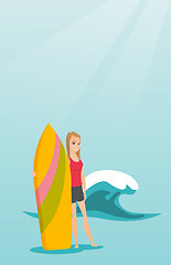 Image showing Young caucasian surfer holding a surfboard.