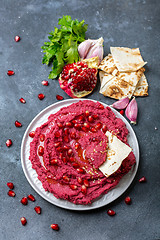 Image showing Homemade traditional beetroot hummus.