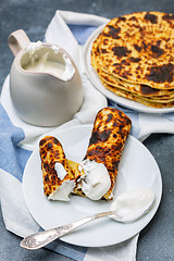 Image showing Homemade potato pancakes lefse with sour cream.