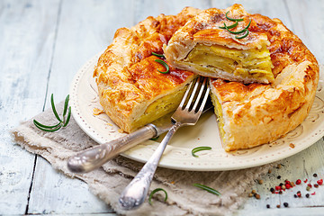 Image showing Puff pastry pie dish with potatoes and rosemary.