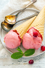 Image showing Waffle cones with cranberry ice cream balls.