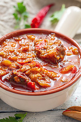 Image showing Thick meat soup with potatoes and paprika close-up.