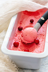 Image showing Homemade cranberry ice cream and ice cream spoon.