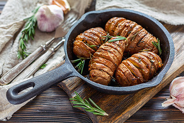 Image showing Frying pan with roasted potatoes and rosemary.