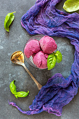 Image showing Homemade blueberry ice cream with green basil.