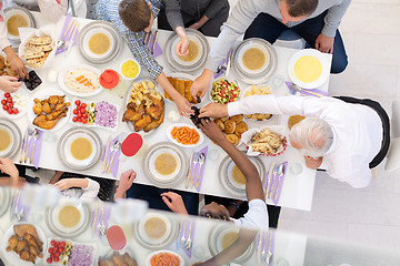 Image showing top view of modern multiethnic muslim family having a Ramadan fe