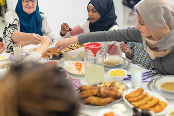 Image showing modern multiethnic muslim family having a Ramadan feast