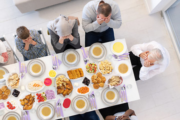 Image showing top view of modern muslim family having a Ramadan feast