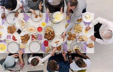 Image showing top view of modern multiethnic muslim family having a Ramadan fe