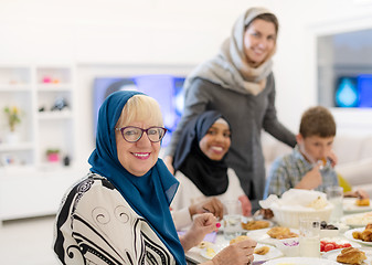 Image showing modern multiethnic muslim family having a Ramadan feast