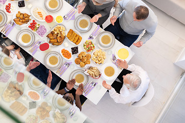 Image showing top view of modern muslim family having a Ramadan feast