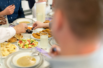 Image showing modern multiethnic muslim family having a Ramadan feast