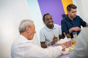 Image showing black man enjoying iftar dinner with family