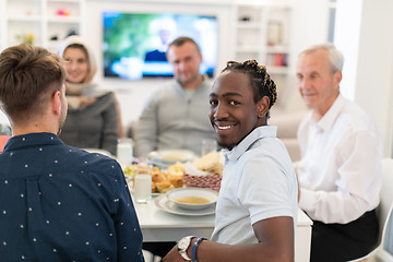 Image showing black man enjoying iftar dinner with family