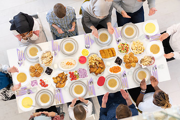 Image showing top view of modern muslim family having a Ramadan feast