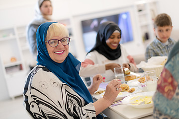 Image showing modern multiethnic muslim family having a Ramadan feast