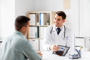 Image showing doctor with tablet computer and patient at clinic