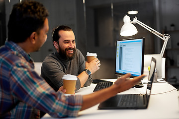 Image showing creative team drinking coffee at night office