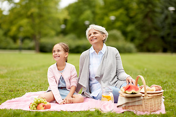 Image showing grandmother and granddaughter at picnic in park