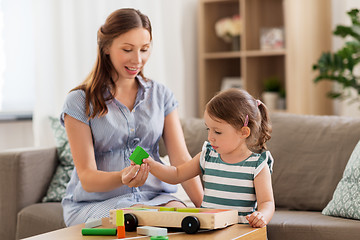 Image showing pregnant mother and daughter with toy blocks