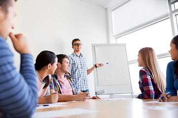 Image showing group of high school students with flip chart