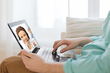 Image showing man having video call with helpline operator