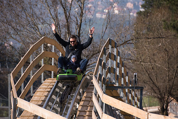 Image showing father and son enjoys driving on alpine coaster