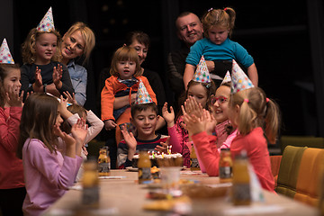 Image showing The young boy joyfully celebrating his birthday