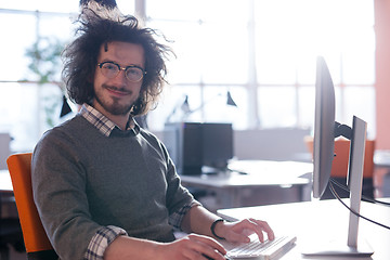 Image showing businessman working using a computer in startup office