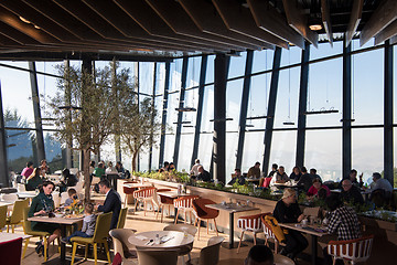 Image showing Young parents enjoying lunch time with their children