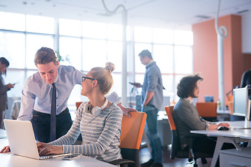 Image showing Two Business People Working With laptop in office