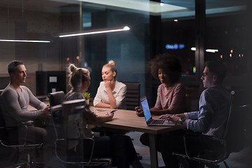 Image showing Multiethnic startup business team in night office