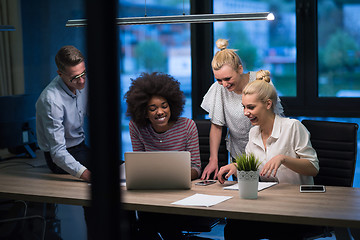 Image showing Multiethnic startup business team in night office